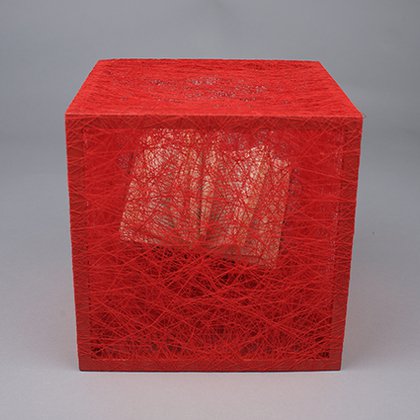 Chiharu Shiota, State of Being (Books), 2021.Metal frame, books, red thread, 50 x 50 x 30 cm.Courtesy of the Artist and Private Collection.