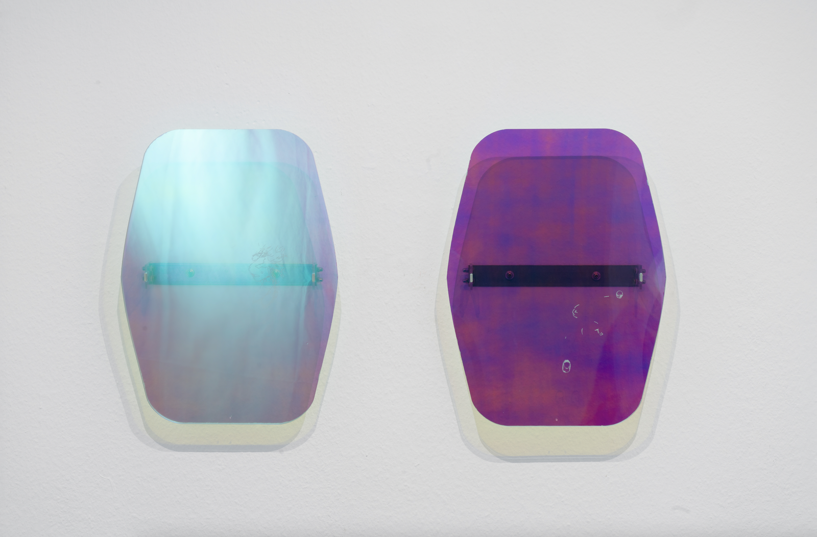 Lena Marie Emrich, Tainted Air Series (Cessna), 2021.Installation view, plexiglass, tinted plexiglass, iris foil, stainless steel, 48.5 cm x 35.72 cm, series of 12, each unique.Courtesy of the Artist, Anaïs Lellouche and Office Impart.