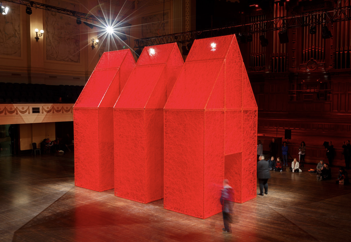 Chiharu Shiota, The Home Within, 2016, metal frame, red wool.Installation view for group exhibition at Melbourne Festival, Melbourne, Australia, 2016.Courtesy of the artist and Anna Schwartz Gallery. Photo: James Henry. © DACS 2022.