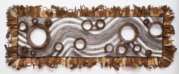 Lorraine Connelly-Northey, Possum-skin cloak: Blackfella road, 2011-2013.Rusted iron and tin, fencing and barbed wire, wire, 268.5 x 703.0 cm irreg.National Gallery of Victoria, Melbourne© Lorraine Connelly-NortheyCourtesy of the artist and National Gallery of Victoria, Melbourne